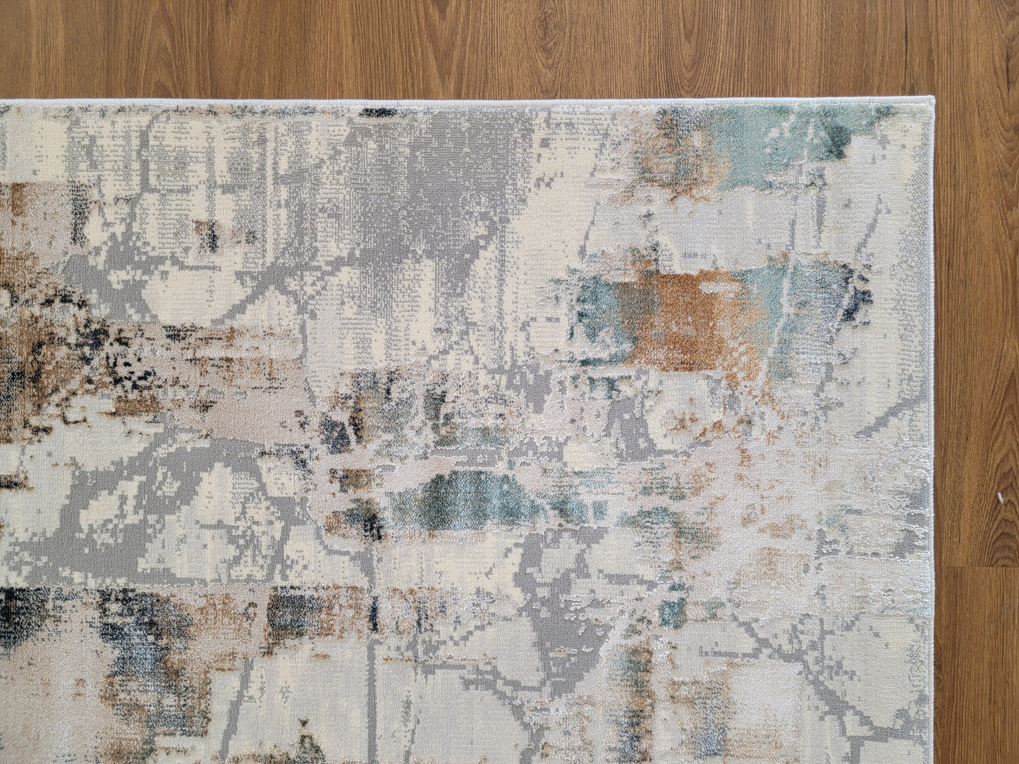 Emojy Abstract Area Rug. Cream, Light Gray, and Light Blue