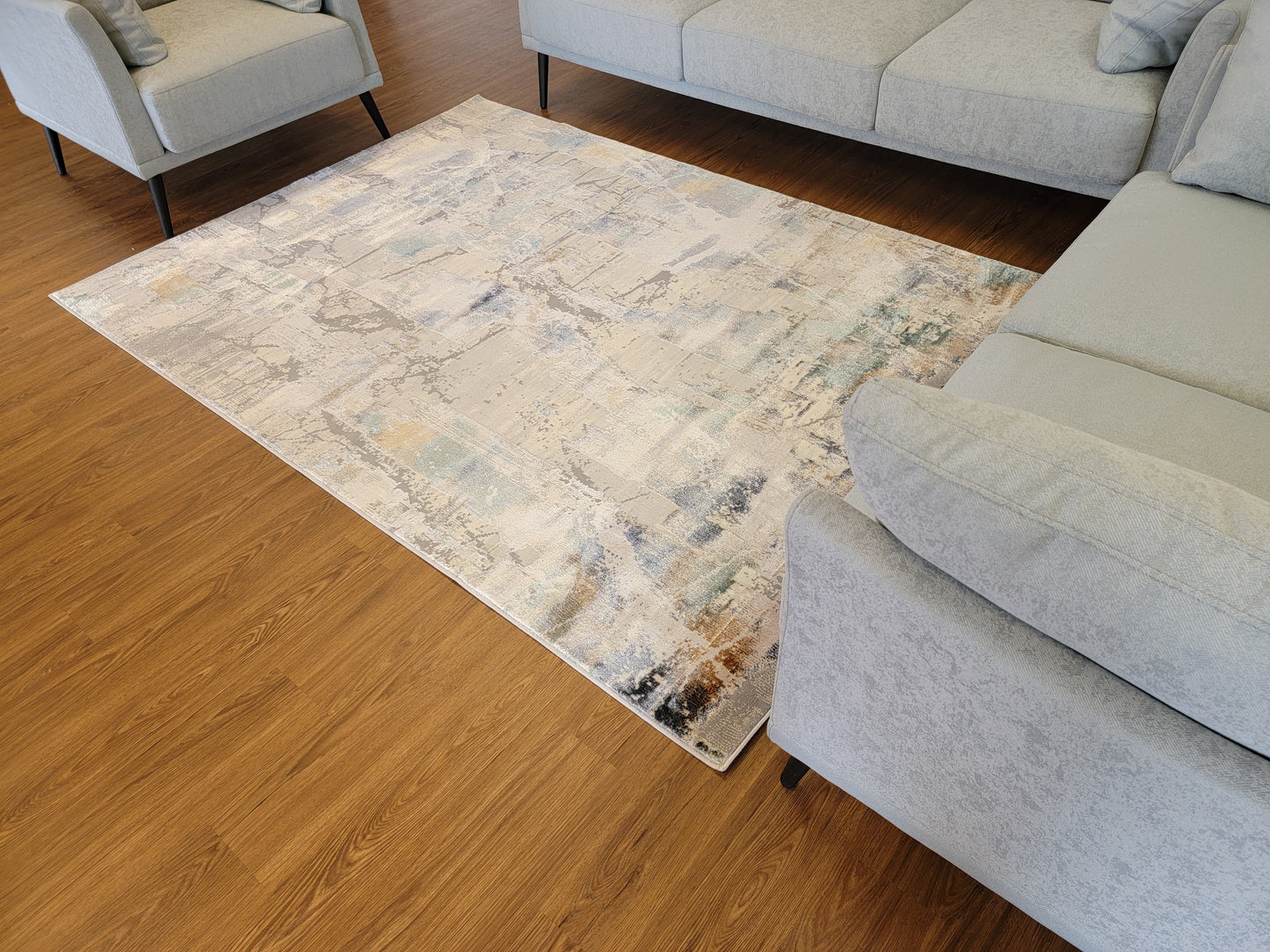 Emojy Abstract Area Rug. Cream, Light Gray, and Light Blue