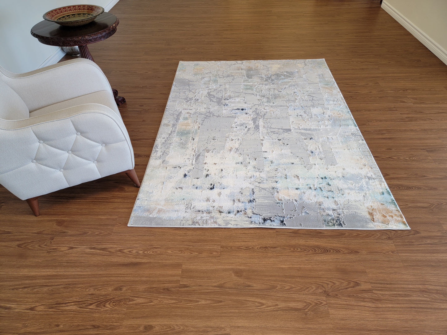 Emojy Abstract Area Rug. Cream, Light Gray, and Light Blue