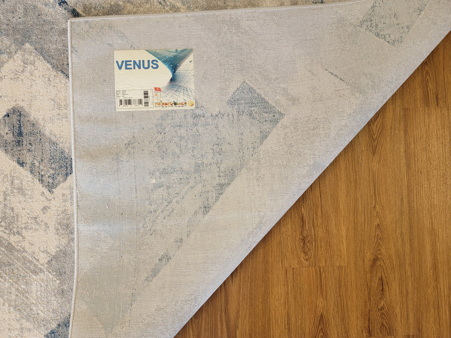 Venus Geometric Area Rug. White, Blue, and Light Gray